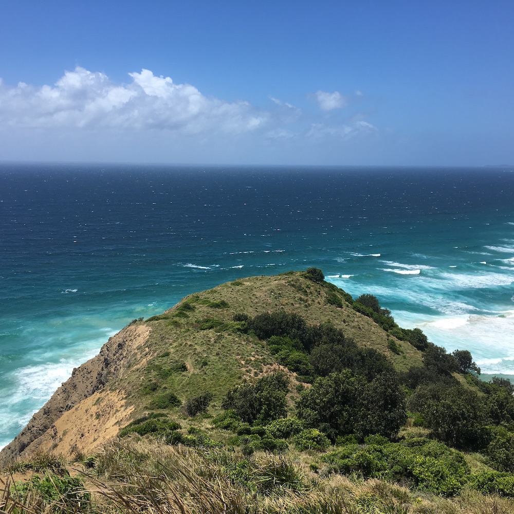 The photo captures the beautiful scenery of the ocean at Byron Bay, New South Wales, Australia. 